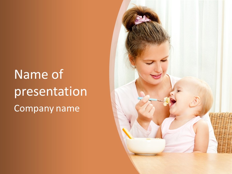 A Woman Feeding A Baby With A Spoon PowerPoint Template