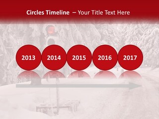 A Stop Light On A Snowy Road With Trees In The Background PowerPoint Template