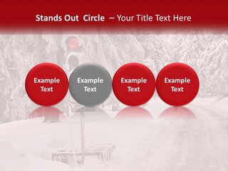 A Stop Light On A Snowy Road With Trees In The Background PowerPoint Template