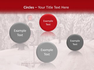 A Stop Light On A Snowy Road With Trees In The Background PowerPoint Template