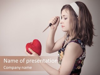 A Girl Holding A Heart With A Knife In Her Hand PowerPoint Template