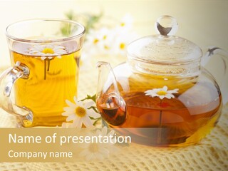 A Tea Pot And A Cup Of Tea On A Table PowerPoint Template