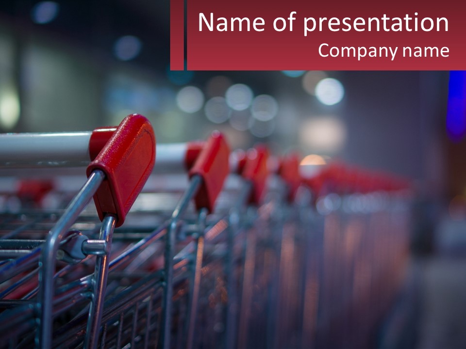 A Row Of Shopping Carts With Red Handles PowerPoint Template
