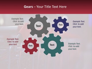 A Row Of Shopping Carts With Red Handles PowerPoint Template