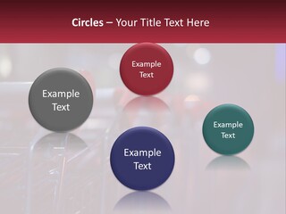 A Row Of Shopping Carts With Red Handles PowerPoint Template
