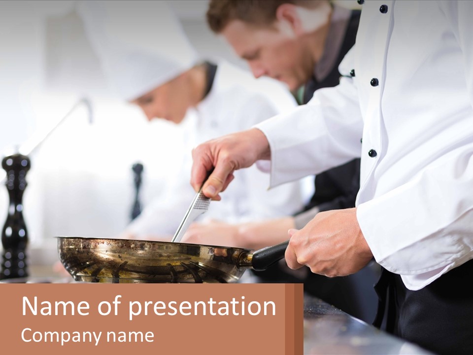 A Group Of Chefs Preparing Food In A Kitchen PowerPoint Template