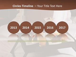 A Bed With A Tray Of Food On Top Of It PowerPoint Template