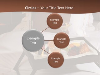A Bed With A Tray Of Food On Top Of It PowerPoint Template