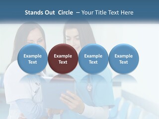 Two Women In Scrubs Are Looking At A Tablet PowerPoint Template