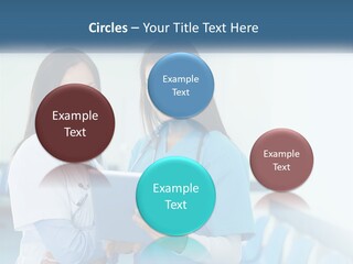 Two Women In Scrubs Are Looking At A Tablet PowerPoint Template