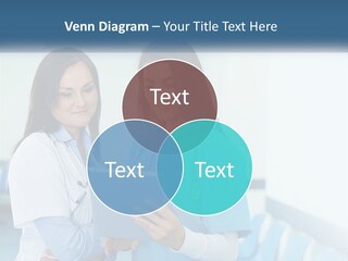 Two Women In Scrubs Are Looking At A Tablet PowerPoint Template