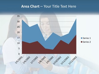 Two Women In Scrubs Are Looking At A Tablet PowerPoint Template