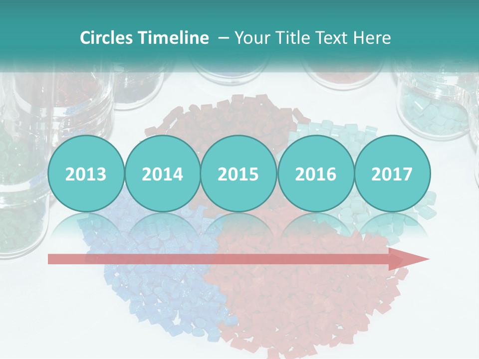 A Bunch Of Different Colored Rocks On A Table PowerPoint Template