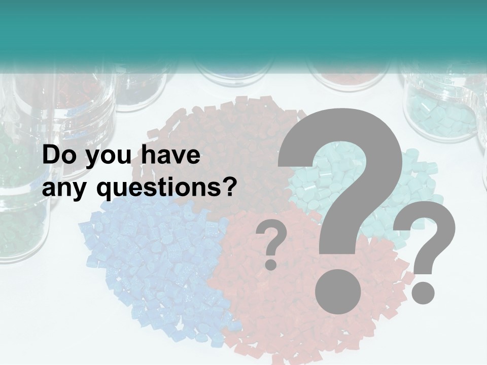 A Bunch Of Different Colored Rocks On A Table PowerPoint Template