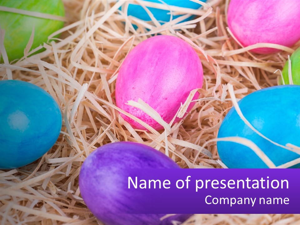 A Bunch Of Colorful Eggs In A Pile Of Straw PowerPoint Template