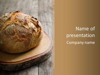 A Loaf Of Bread Sitting On Top Of A Wooden Plate PowerPoint Template