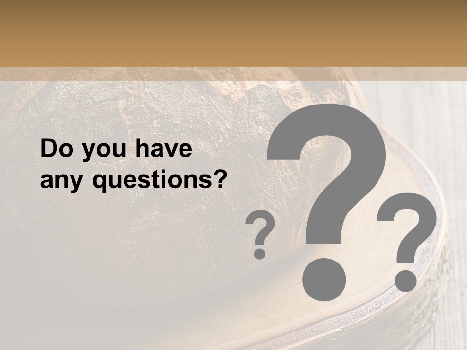 A Loaf Of Bread Sitting On Top Of A Wooden Plate PowerPoint Template