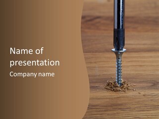 A Screw With A Hole In It On A Wooden Table PowerPoint Template