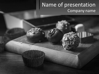 A Wooden Cutting Board Topped With Cupcakes And Muffins PowerPoint Template