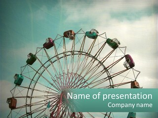A Ferris Wheel On A Cloudy Day With A Sky Background PowerPoint Template