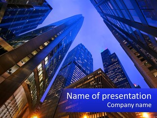 A Group Of Skyscrapers In A City At Night PowerPoint Template