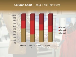A Woman Looking At A Cell Phone In A Clothing Store PowerPoint Template