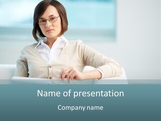 A Woman Sitting At A Desk In Front Of A Laptop Computer PowerPoint Template
