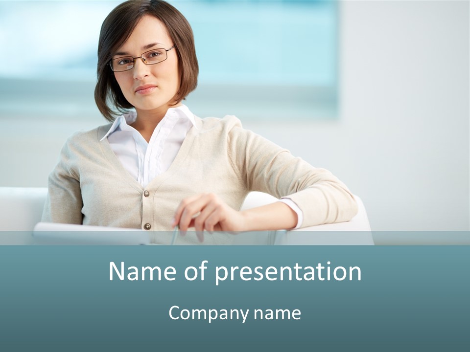 A Woman Sitting At A Desk In Front Of A Laptop Computer PowerPoint Template
