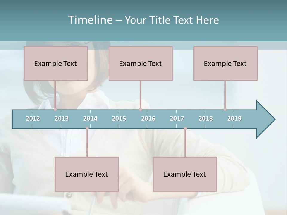 A Woman Sitting At A Desk In Front Of A Laptop Computer PowerPoint Template