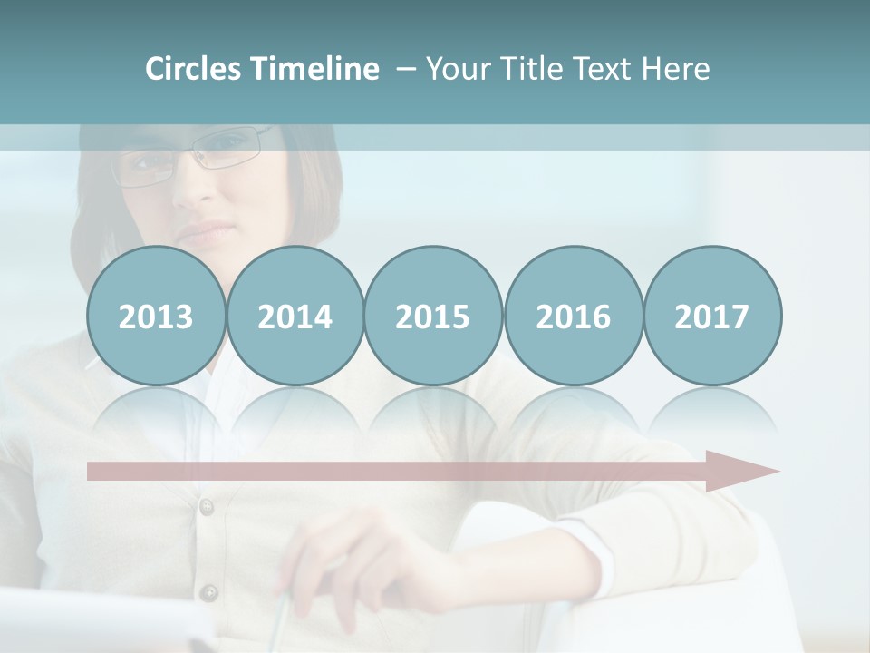 A Woman Sitting At A Desk In Front Of A Laptop Computer PowerPoint Template