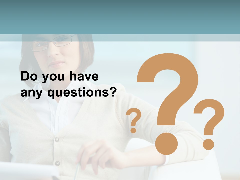 A Woman Sitting At A Desk In Front Of A Laptop Computer PowerPoint Template