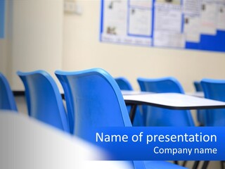 A Classroom With Blue Chairs And A Bulletin Board PowerPoint Template
