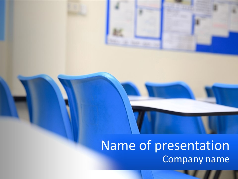 A Classroom With Blue Chairs And A Bulletin Board PowerPoint Template