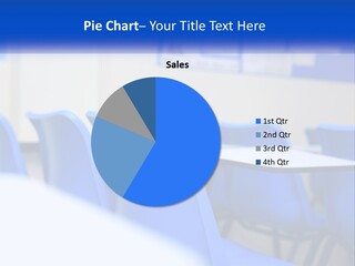 A Classroom With Blue Chairs And A Bulletin Board PowerPoint Template