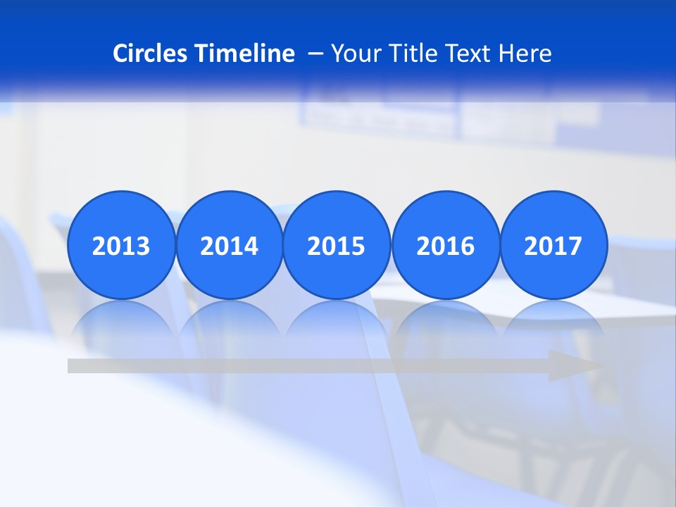 A Classroom With Blue Chairs And A Bulletin Board PowerPoint Template