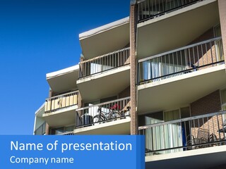 A Tall Building With Balconies And Balconies On The Balconies PowerPoint Template