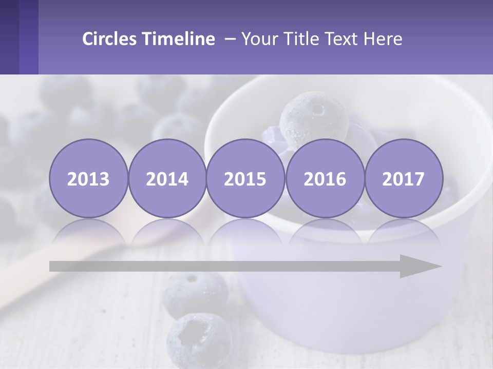 A Bowl Of Blueberries With A Spoon On The Side PowerPoint Template