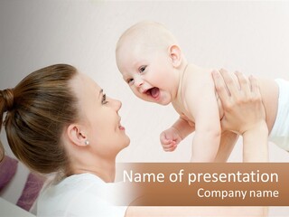 A Woman Holding A Baby In Her Arms PowerPoint Template