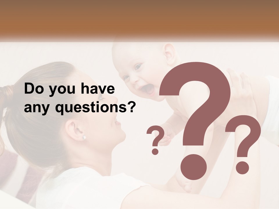 A Woman Holding A Baby In Her Arms PowerPoint Template