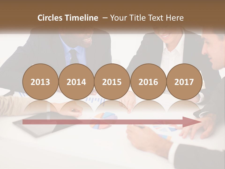 A Group Of Business People Sitting Around A Table PowerPoint Template