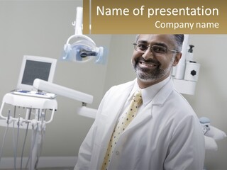 A Man In A White Lab Coat And Tie Standing In Front Of A Dentist Chair PowerPoint Template