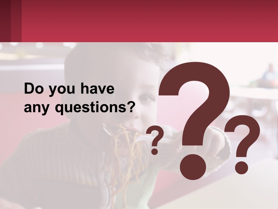 A Young Boy Eating Noodles In A Restaurant PowerPoint Template