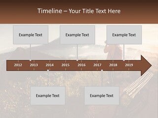 A Person Taking A Picture Of A Mountain With A Camera PowerPoint Template