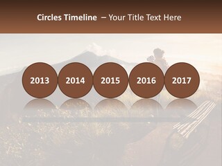 A Person Taking A Picture Of A Mountain With A Camera PowerPoint Template