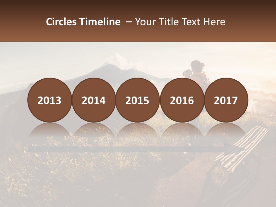 A Person Taking A Picture Of A Mountain With A Camera PowerPoint Template