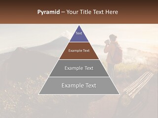 A Person Taking A Picture Of A Mountain With A Camera PowerPoint Template