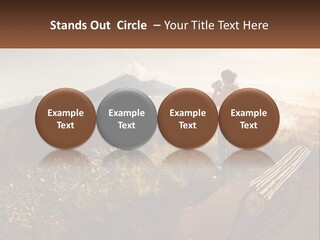 A Person Taking A Picture Of A Mountain With A Camera PowerPoint Template