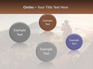 A Person Taking A Picture Of A Mountain With A Camera PowerPoint Template