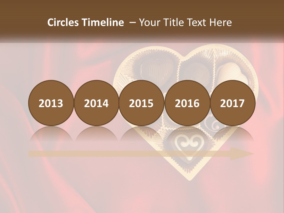 A Heart Shaped Box Filled With Chocolates On A Red Cloth PowerPoint Template