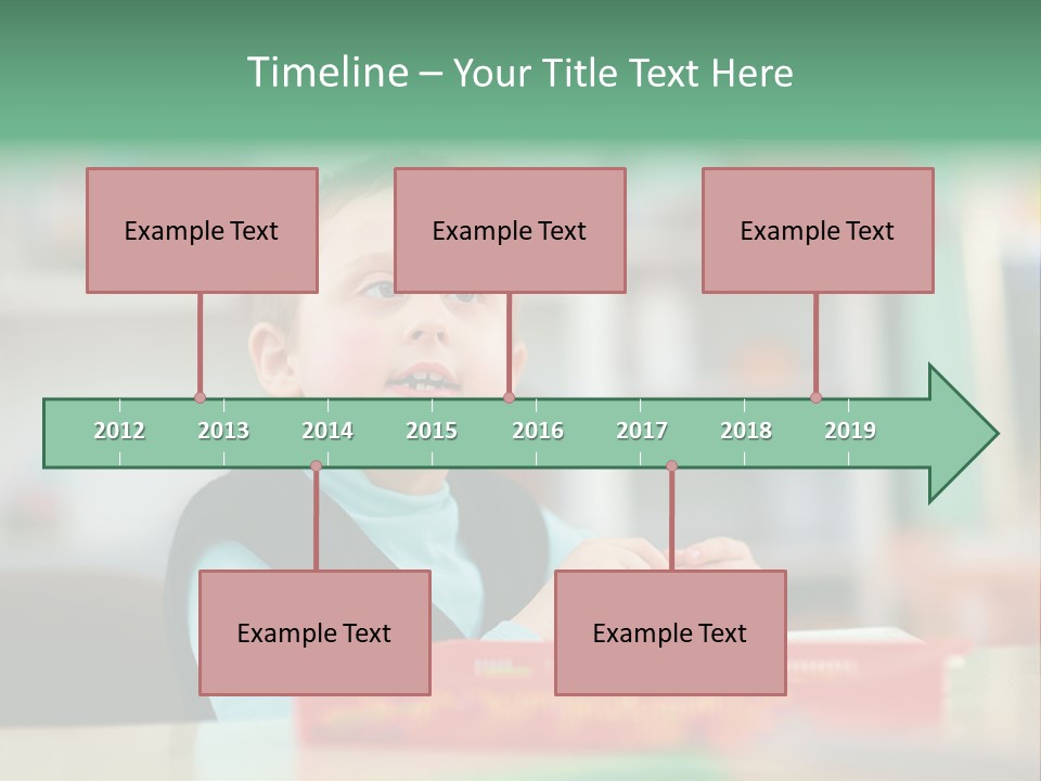 A Young Boy Is Sitting At A Table PowerPoint Template
